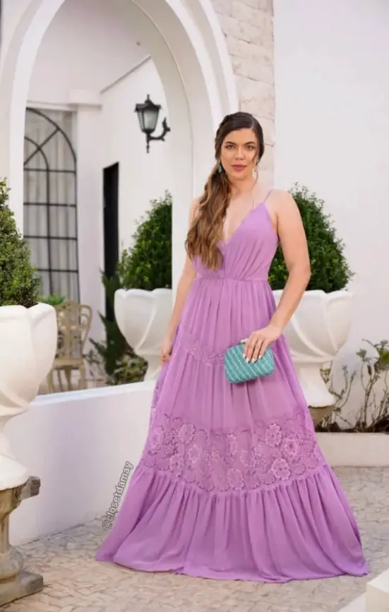 Woman in lilac dress with white nails