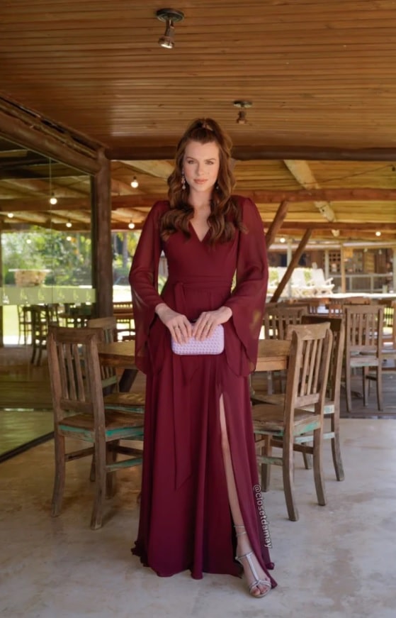 Woman in a burgundy dress with silver shoes