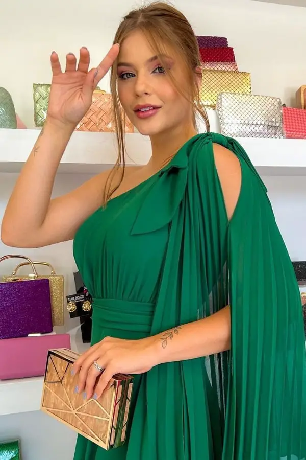 Emerald green dress with light blue nail polish