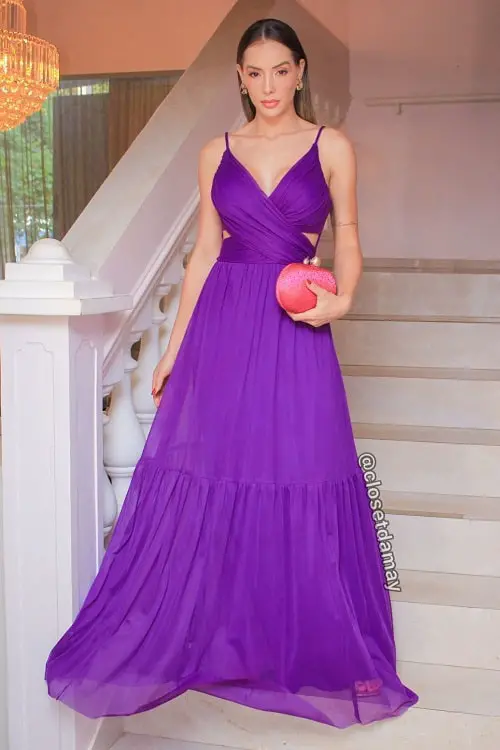 Purple dress with coral clutch bag