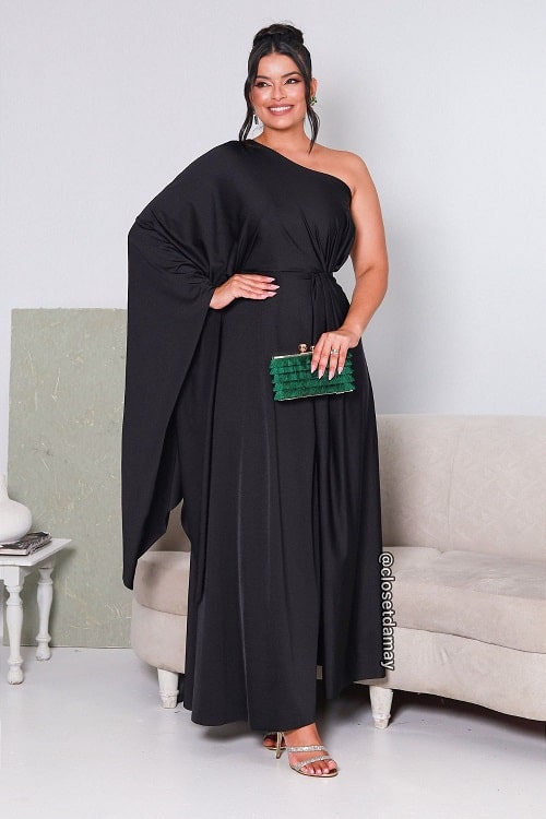 Black dress with emerald green clutch bag