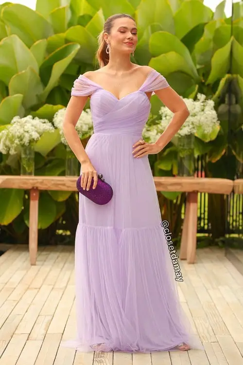 Lavender dress with purple clutch bag