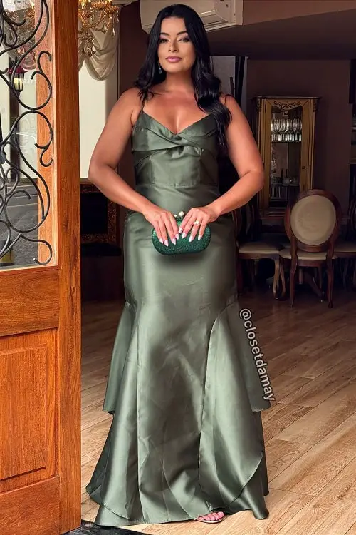 Olive green dress with emerald green clutch bag